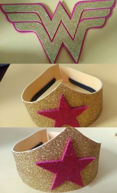 the wonder woman crown is made out of cardboard and has pink glitter stars on it