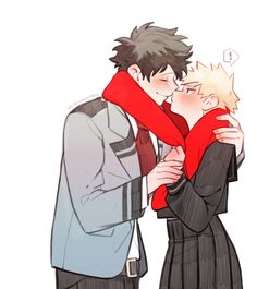 two people kissing each other while wearing red scarfs