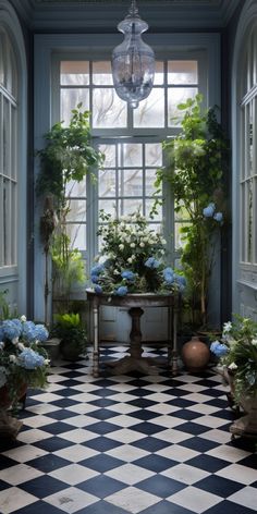 a checkered floor with potted plants and a chandelier hanging from the ceiling