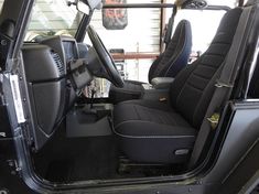 the interior of a vehicle with black leather seats