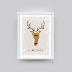 a deer with antlers on it's head and the words, my first christmas