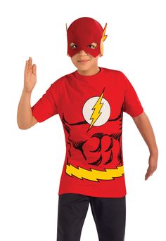 a young boy in a red shirt and black pants is dressed as the flash with his hands up