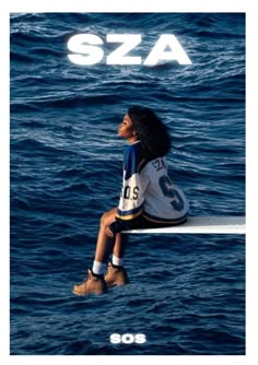 a woman sitting on top of a surfboard in the middle of the ocean,