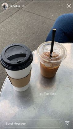 a cup of coffee sitting on top of a table