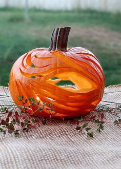 a carved pumpkin sitting on top of a table