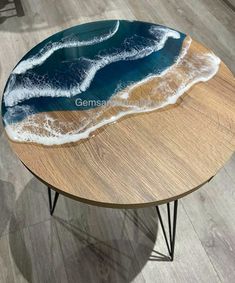 a coffee table with an ocean wave painted on it