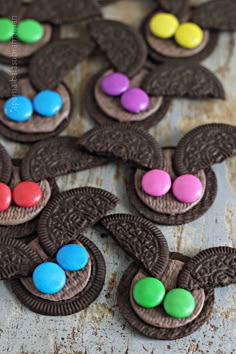 cookies decorated with chocolate and candy are sitting on a table