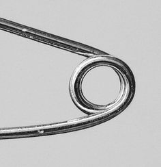 a pair of scissors is shown in this black and white photo, which appears to be curved