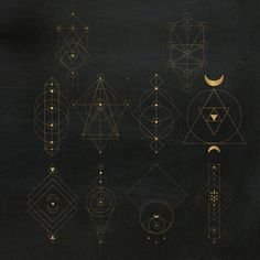 the golden lines and shapes are arranged on black paper