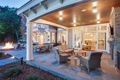 an outdoor living area with patio furniture and fire pit