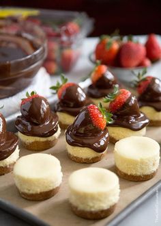 there are many desserts on the tray ready to be eaten