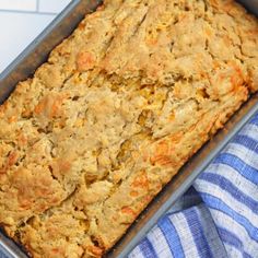 a casserole in a pan on a blue and white towel