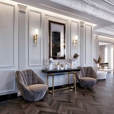 a room with two chairs and a table in front of some mirrors on the wall