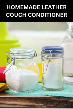 homemade leather couch conditioner in glass jars on a blue towel next to other items