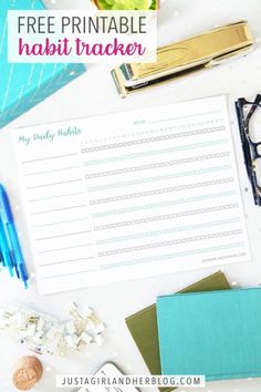 an assortment of office supplies including pens, paper and pencils on a table top