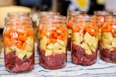 several jars filled with food sitting on top of a table