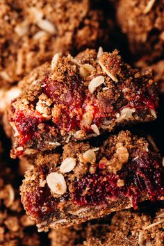 two pieces of cranberry oatmeal bars stacked on top of each other