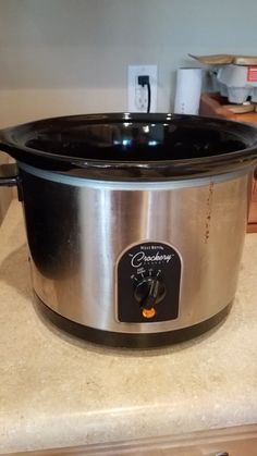 a crock pot sitting on top of a kitchen counter