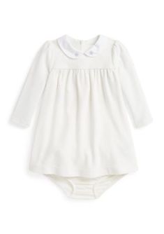 A charming pick for the seasons festivities, this cotton-blend dress unites smooth brushed velour, an empire-waist silhouette, and embroidered holly at the collar. By choosing Ralph Lauren Childrenswear's cotton products, youre supporting the investment in the Better Cotton mission to help cotton communities survive and thrive while protecting and restoring the environment. This product is sourced via a system of mass balance and therefore may not contain Better Cotton. Visit bettercotton.org/massbalance for more information about mass balance. Empire-waist silhouette Size 9 months has a 16.75" body length (front and back) and a 14.5" sleeve length Sleeve length is taken from the center back of the neck Woven Peter Pan collar Holly embroidered at each collar point Buttoned placket at the c Embroidered Holly, Puffed Long Sleeves, Velour Dress, Baby Bloomers, Cotton Blends Dress, Gameday Outfit, Fall Jackets, Set Outfit, Ralph Lauren Polo