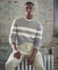 This sweater is the definition of what Todd calls a “luxe essential,” a go-to that he’s refreshed with an elevated fabric, neutral palette, and sophisticated design details. In this particular case, it’s made from a wonderfully soft cashmere yarn in a relatively dense 12-gauge knit. Inspired by vintage athletic styles, the gray heather and cream stripes echo classic collegiate sweats. The timeless crewneck silhouette is complemented by traditional sweatshirt details like a double-layered hem and cuffs and a ribbed “dorito” at the neck.  100% Cashmere Made in China 12-Gauge Knit 2-Needle Welt Stitch at Seams Ribbed Dorito at Neck Double-Layer Cuffs and Hem Hand Wash. Dry Clean. Do Not Tumble Dry. Lay Flat to Dry. Style SW9077696 Stripe Sweatshirt, Crewneck Style, Men's Sweaters, Cashmere Yarn, Striped Sweatshirts, Grey Crewneck, Savile Row, Neutral Palette, Menswear Inspired