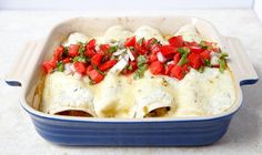 a casserole dish filled with meat and vegetables on top of a white counter