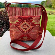 "Warm Autumn Color Vegan crossbody or shoulder bag. A wonderful everyday bag. Super Quality Chenille Industrial Upholstery Tapestry and Oriental Rug Style Tapestry imported from Turkey. This bag is loaded with pockets! The outside has a deep zipper pocket on each side .   Top zip opens to roomy interior with 4 more smaller pockets. Inside fits an iPad mini. Strap is sturdy web material in Burgundy and adjustable to shoulder bag or crossbody length.  Great as a travel purse-very light weight. 9.5 Tapestry Shoulder Bag With Removable Pouch, Everyday Tapestry Rectangular Shoulder Bag, Everyday Rectangular Tapestry Shoulder Bag, Daily Use Tapestry Pouch Bag, Tapestry Shoulder Bag With Removable Pouch For Travel, Tapestry Tote Shoulder Bag For Travel, Tapestry Shoulder Bag With Adjustable Strap, Tapestry Bag For Everyday Use, Travel Shoulder Bag With Removable Pouch In Tapestry