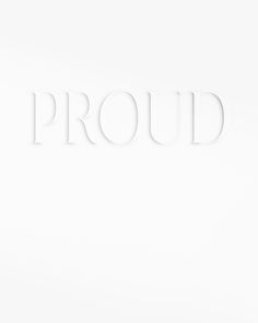 the word proud is made up of white letters