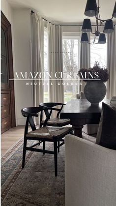 a dining room table and chairs with the words amazon curtains above it in front of a large window