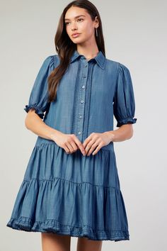 When hot weather hits, it's chambray all day. Get ready with this tiered shirt dress. Relaxed and lightweight, it's got a pointed collar, puffed sleeves, and a swingy shape. Scallop detailing runs along the placket and cuffs. •Pointed collar •Side Pockets •Button placket •Short sleeves •Tiered skirt •Scallop detailing DIMENSIONS •Standard: 35.25" Length Item number 2490161 100% Lyocell Casual Summer Shirt Dress With Puff Sleeves, Casual Puff Sleeve Shirt Dress For Summer, Spring Casual Puff Sleeve Shirt Dress, Casual Shirt Dress With Ruffle Hem For Spring, Casual Ruffled Shirt Dress For Spring, Spring Daywear Puff Sleeve Tiered Dress, Spring Daywear Puff Sleeve Dress With Tiered Skirt, Casual Puff Sleeve Tiered Dress For Brunch, Casual Puff Sleeve Brunch Dress With Tiered Skirt