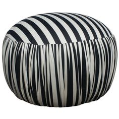 a large black and white striped ottoman