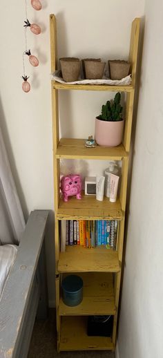 a wooden shelf with books and other items on it