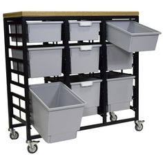 several bins are stacked on top of each other in this storage unit with wheels