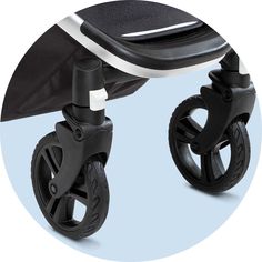 an image of a black and white stroller with wheels on it's side