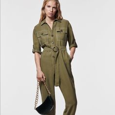 Lapel Collar Jumpsuit With V-Neck And Short Sleeves With Button Tabbed Cuffs. Front Pockets. Tonal Belt And Contrasting Topstitching Detail. Cuffed Hem. Front Button Closure. Brand New With Tags V-neck Jumpsuits And Rompers With Pockets For Work, Utility Jumpsuits And Rompers For Summer Workwear, Summer Khaki Jumpsuits And Rompers For Workwear, Green Jumpsuits And Rompers For Work With Button Closure, Green Workwear Jumpsuits With Pockets, Summer Workwear Pantsuit With Buttons, Chic Khaki Jumpsuits And Rompers For Work, Elegant Zara Jumpsuits And Rompers With Pockets, Khaki Utility Jumpsuits And Rompers For Workwear