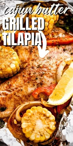 grilled tilapa with corn on the cob and potatoes in foil packet