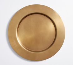 an empty gold plate on a white background