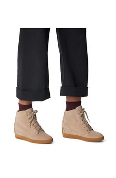 A sporty silhouette adds a casual-cool vibe to this bootie-style sneaker with a soft suede upper and hidden wedge heel. 2 1/2" heel; 1" platform (size 8.5) 5 1/4" shaft Removable insole Cushioned EVA footbed with arch support Leather upper/textile lining/rubber sole Imported Casual High-top Wedge Boots For Spring, Casual High Ankle Wedge Boots With Platform, Casual High Ankle Wedge Boots Medium Width, Casual High-top Wedge Boots With Rubber Sole, Casual Ankle-high Wedge Boots For Fall, Casual Wedge Boots With Rubber Sole, Casual Ankle-high Platform Wedge Boots, Casual Leather Lace-up Wedge Boots, Sporty Suede Boots For Fall