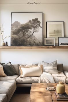 a living room filled with lots of furniture and pictures on top of the wall above it