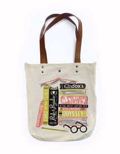 a canvas bag with books and glasses on it