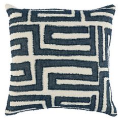 a blue and white pillow with an abstract design on the front, it is made out of