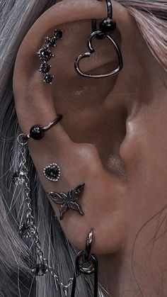 an ear piercing with multiple pieces of jewelry attached to it