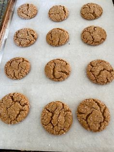 twelve cookies are on a baking sheet ready to be baked in the oven for consumption