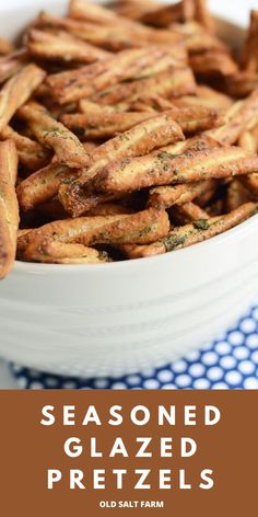 seasoned glazed pretzels in a white bowl on a blue and white tablecloth