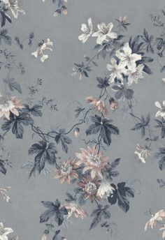 a blue floral wallpaper with white and pink flowers on the top right side of it