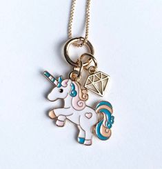 Unicorn necklace - this is a popular item for younger girls. The necklace is durable and has an option of two charms: unicorn and rainbow or unicorn with a jewel charm. The necklace is packaged in a sheer sash bag with heart print. Necklace: 20 inches Whimsical Charm Necklaces For Birthday, Whimsical Charm Necklace For Birthday, Cute Charm Necklaces For Birthday, Whimsical Charm Necklaces For Birthdays, Playful Jewelry With Star Charm For Gift, Cute Jewelry With Star Charm For Gifts, Playful Charms Necklace For Birthday, Cute Star Charm Jewelry Gift, Playful Star Charm Jewelry For Gifts