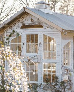 an old white building with lots of windows