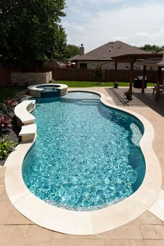 QuartzScapes Regular Series Mariner Blue | NPT Pool Finishes Free Form Pool With Hot Tub, Houses With Pools In The Backyard, Circle Pool Ideas, Free Form Pools With Spa, Small Inground Pool With Hot Tub, Water Features For Pools, Backyard Pool Designs Budget, Budget Friendly Pool Ideas, Small Fiberglass Pool Ideas