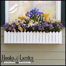 a window box filled with purple and yellow flowers