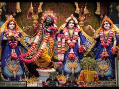 three deities dressed in colorful costumes standing next to each other