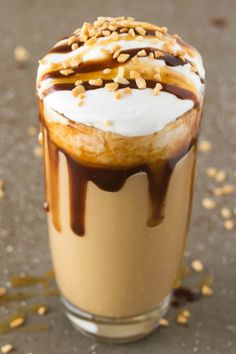 an iced drink with chocolate and marshmallows on the top, drizzled in caramel